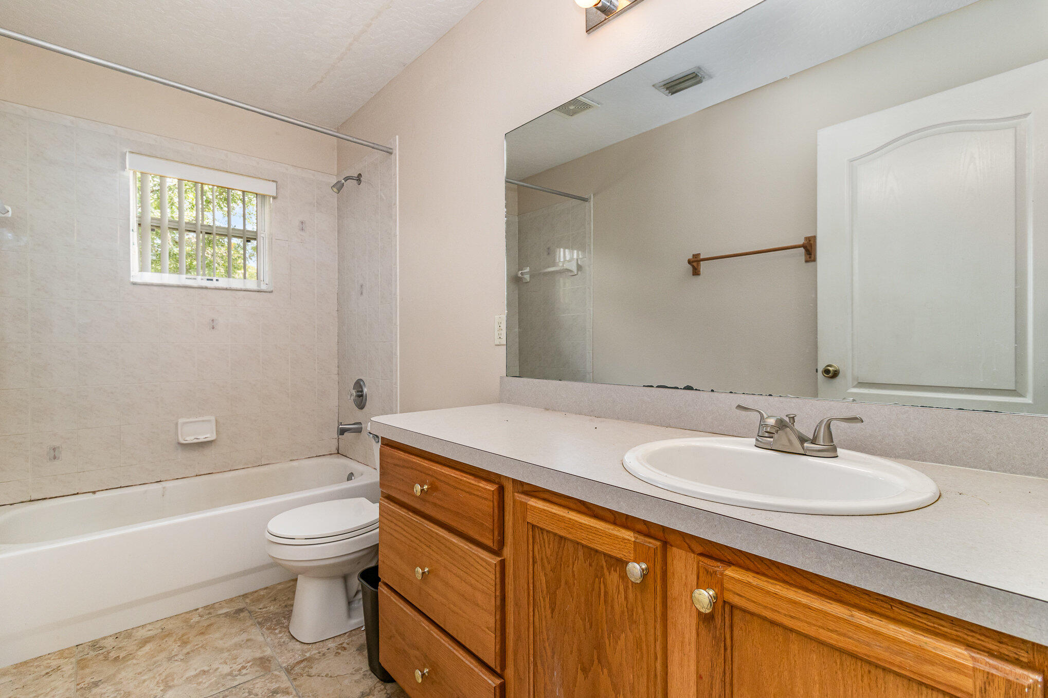697 Furth Road Northwest Palm Bay, FL 32907 - Photo 15 of 24 a bathroom with a sink toilet and shower