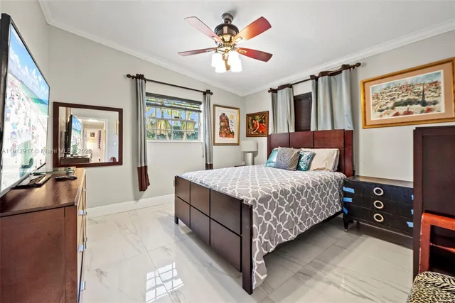 a bedroom with furniture and a window