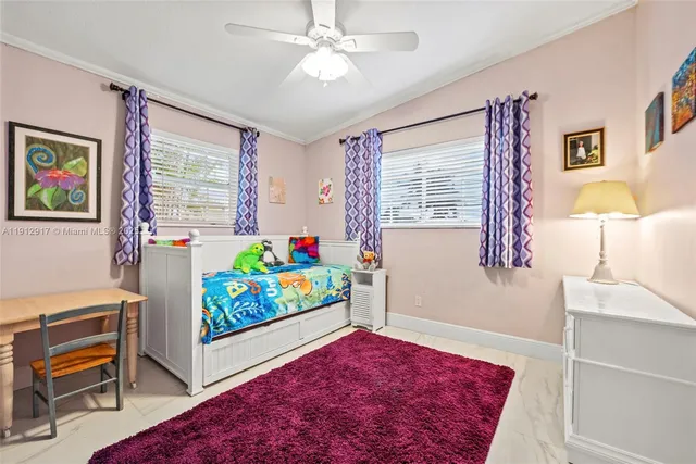 a living room with furniture windows and a wooden floor