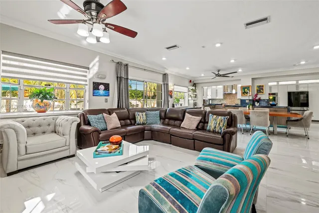 a dining room with furniture a window and a kitchen