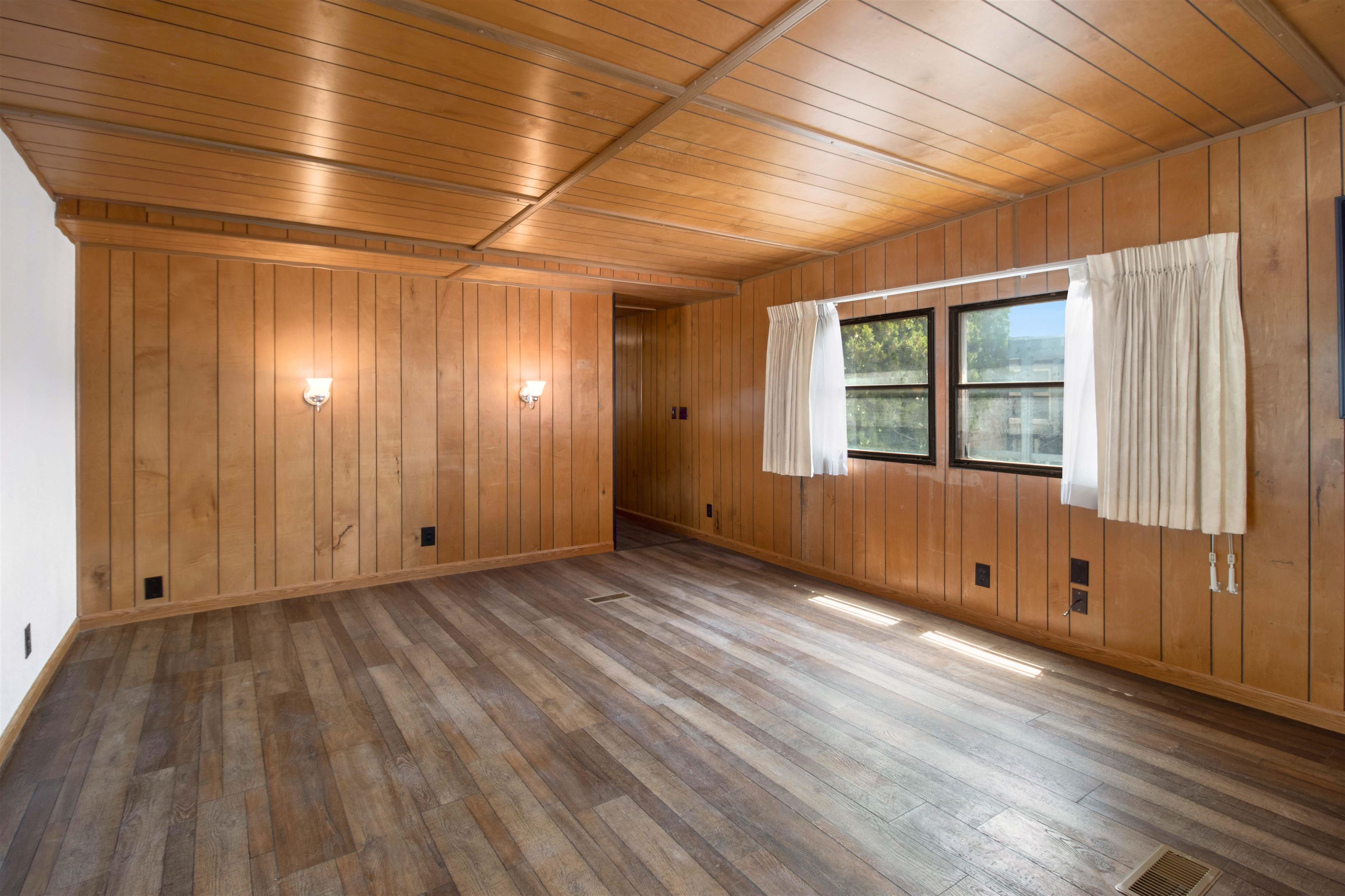 424 32 Road, Unit 27 Clifton, CO 81520 - Photo 4 of 16 a view of an empty room with wooden floor and a window