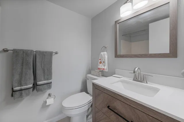 a view of hallway with furniture and a large window
