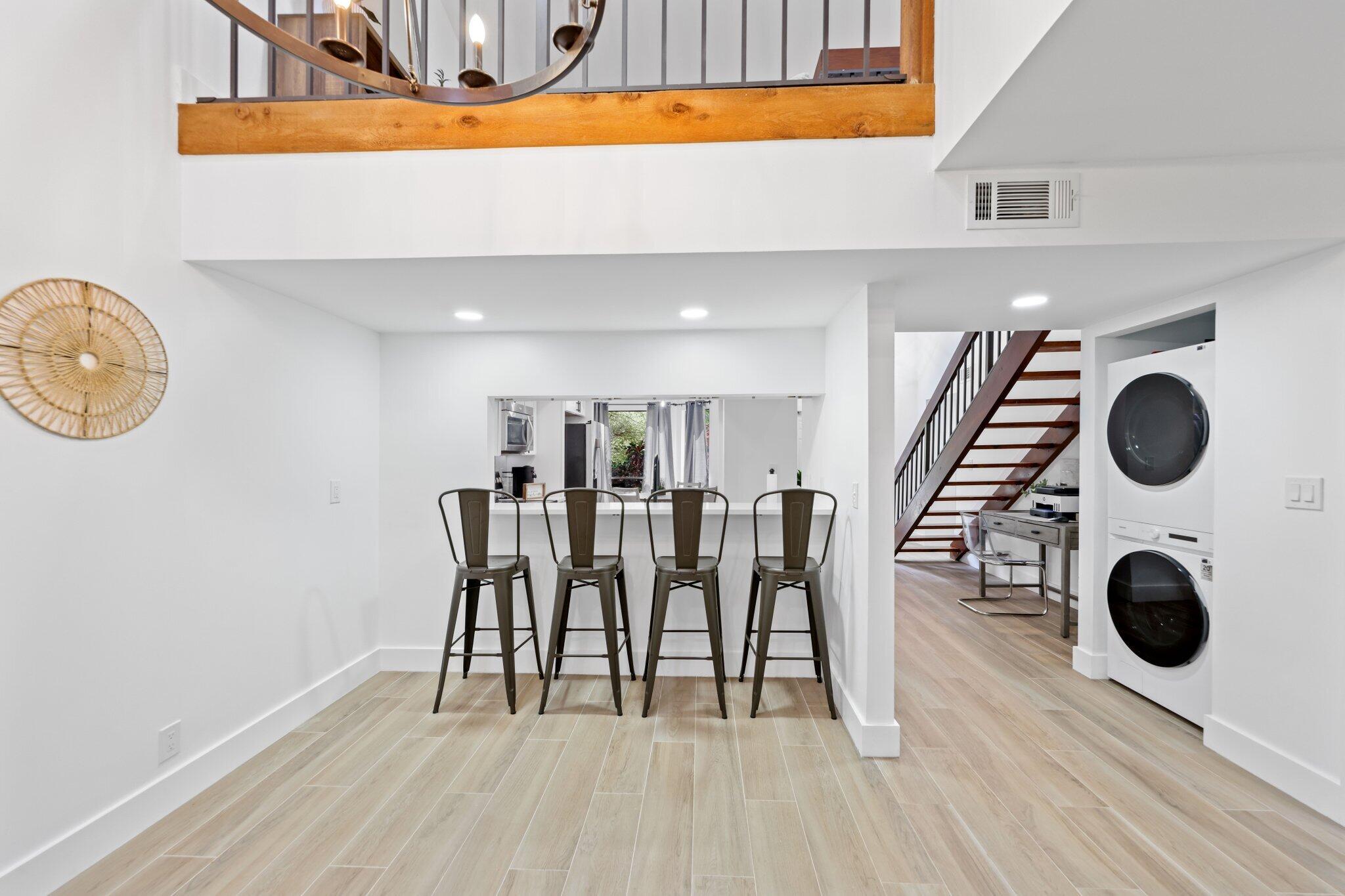 1400 Northwest 9th Avenue, Unit E34 Boca Raton, FL 33486 - Photo 11 of 46 a dining room with furniture and wooden floor