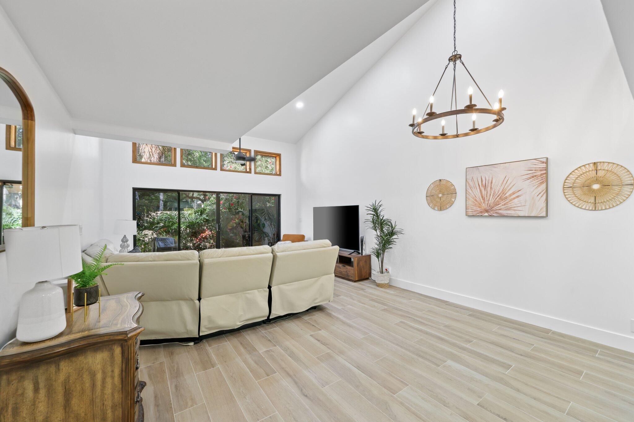 1400 Northwest 9th Avenue, Unit E34 Boca Raton, FL 33486 - Photo 13 of 46 a living room with furniture and a window