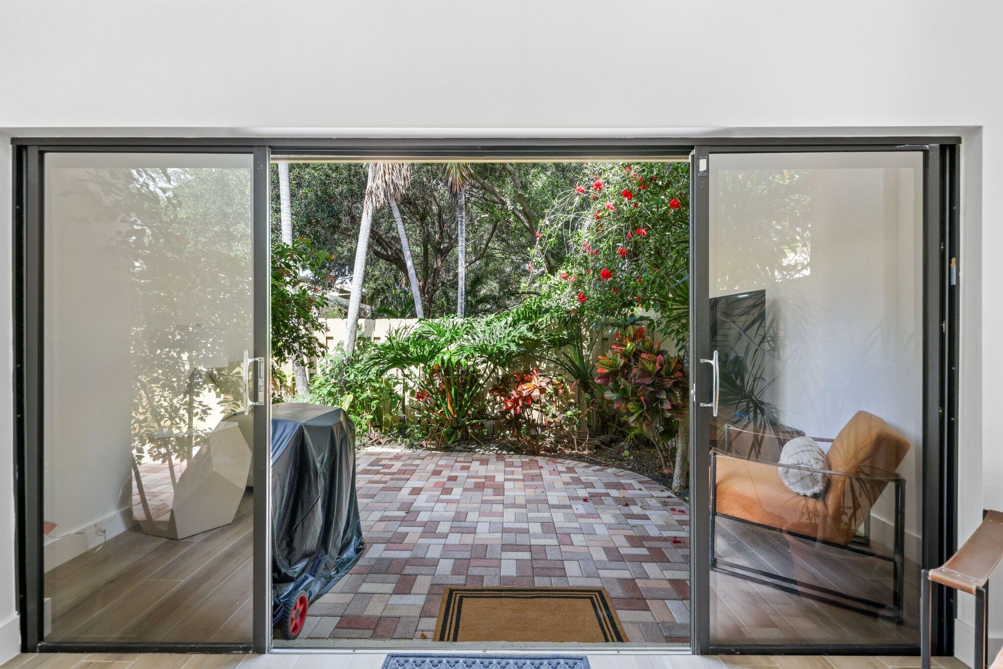 1400 Northwest 9th Avenue, Unit E34 Boca Raton, FL 33486 - Photo 16 of 46 a room with furniture and a potted plant
