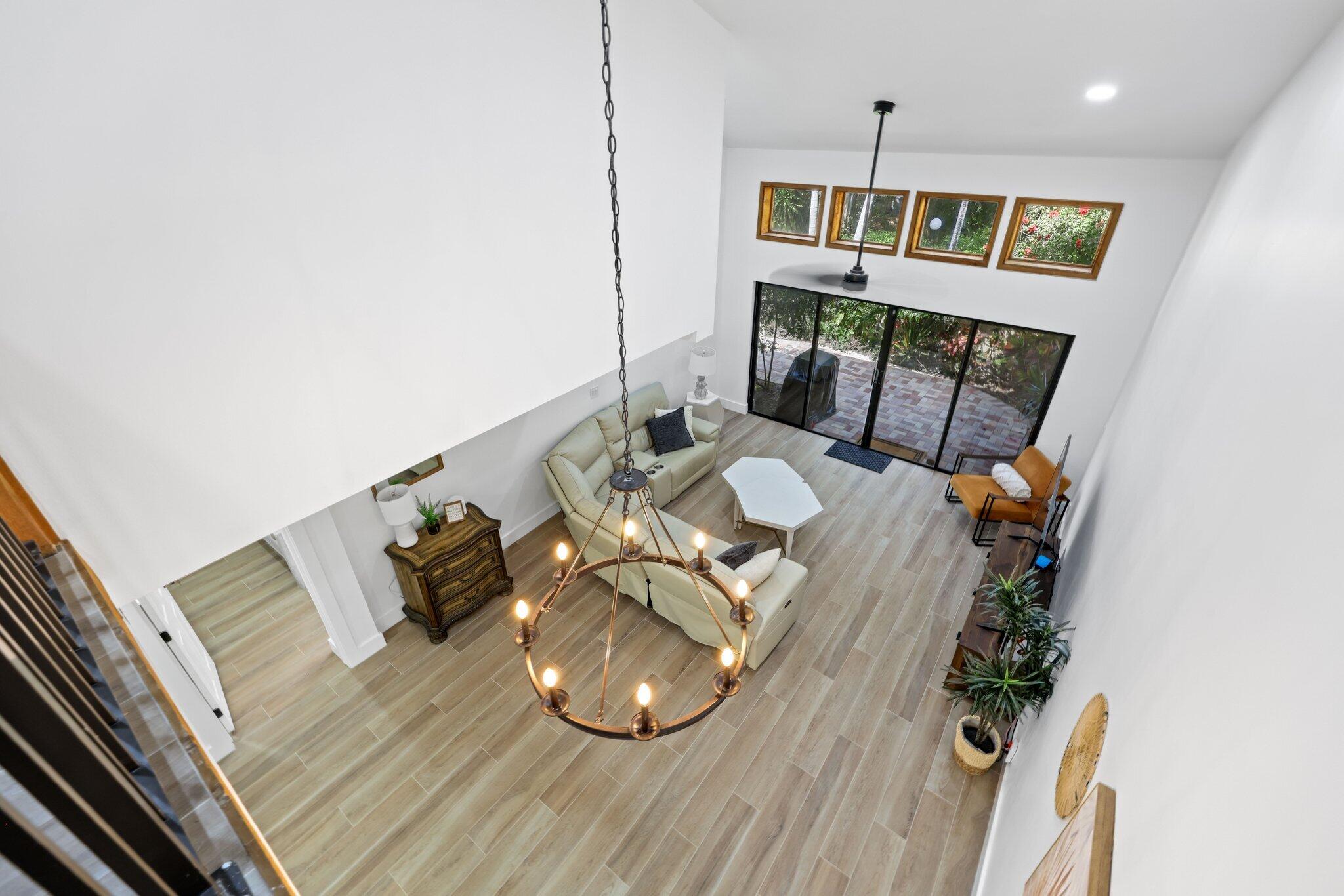 1400 Northwest 9th Avenue, Unit E34 Boca Raton, FL 33486 - Photo 21 of 46 a living room with furniture and a wooden floor
