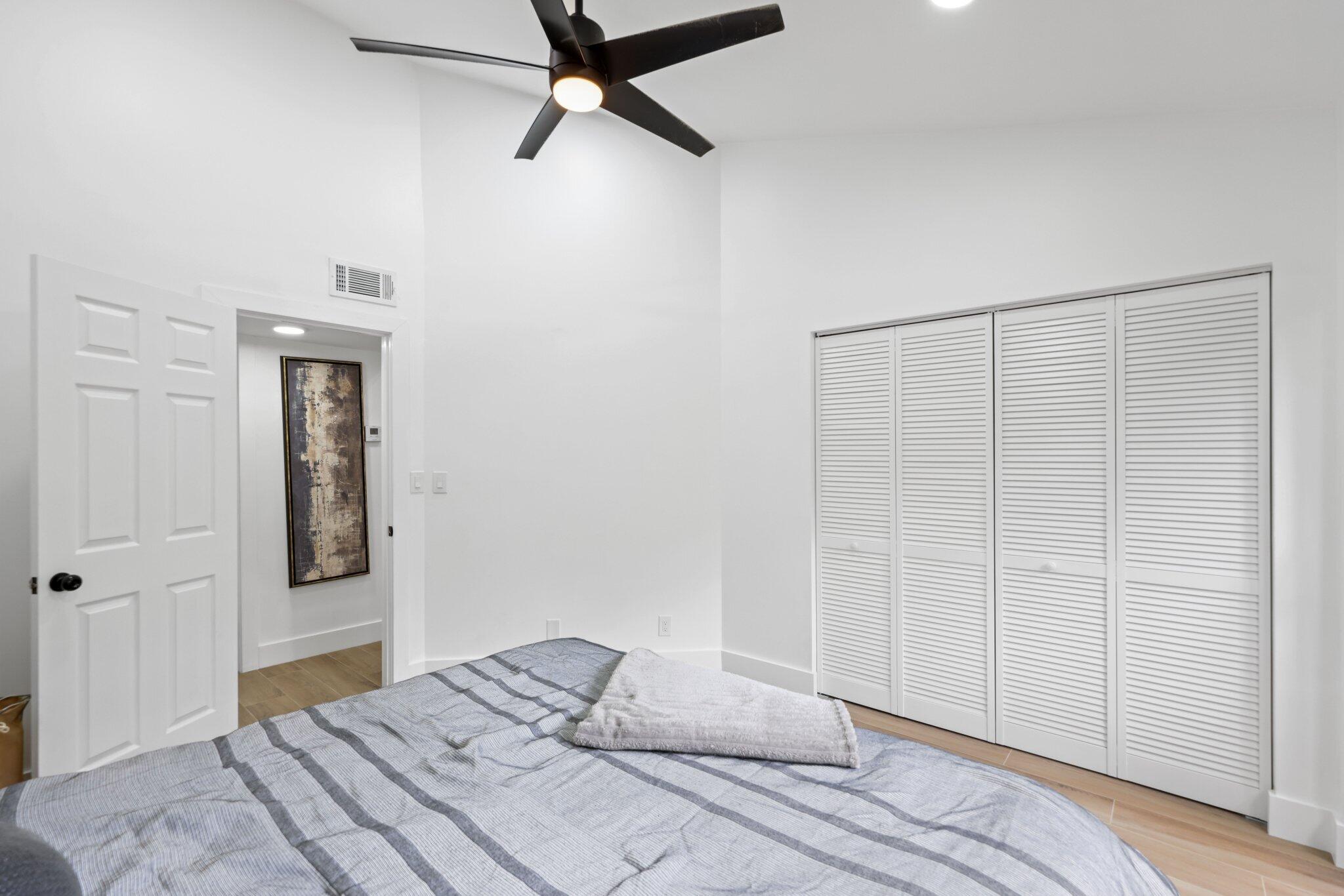 1400 Northwest 9th Avenue, Unit E34 Boca Raton, FL 33486 - Photo 27 of 46 a bedroom with a bed and a window