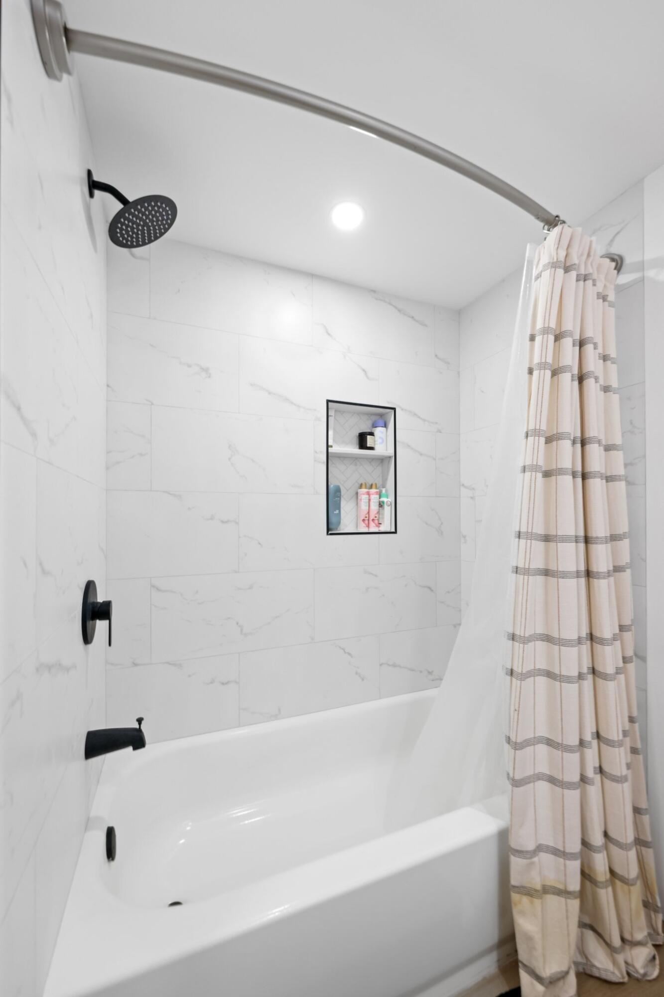 1400 Northwest 9th Avenue, Unit E34 Boca Raton, FL 33486 - Photo 29 of 46 a bathroom with a bathtub and shower