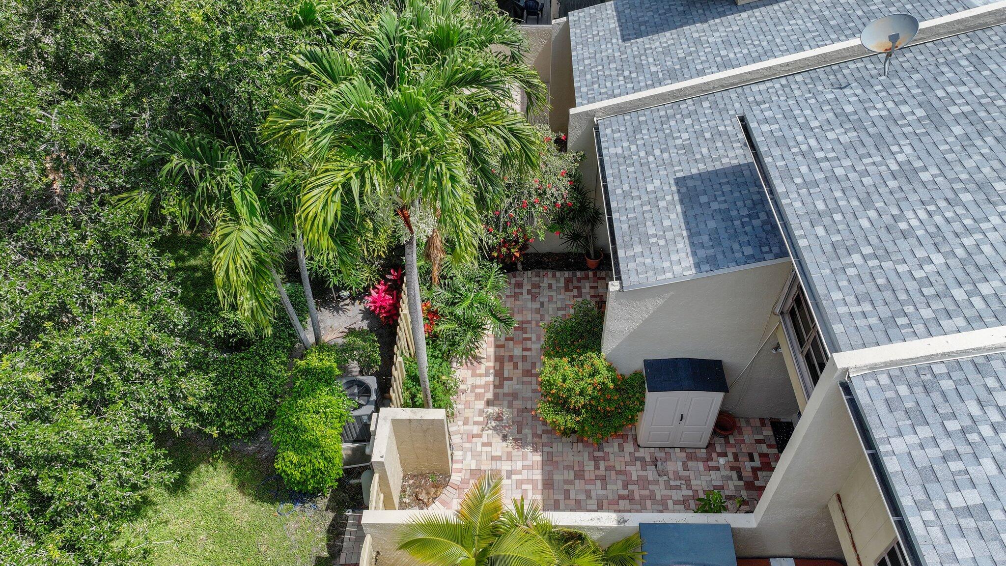 1400 Northwest 9th Avenue, Unit E34 Boca Raton, FL 33486 - Photo 32 of 46 a bird view of house with yard