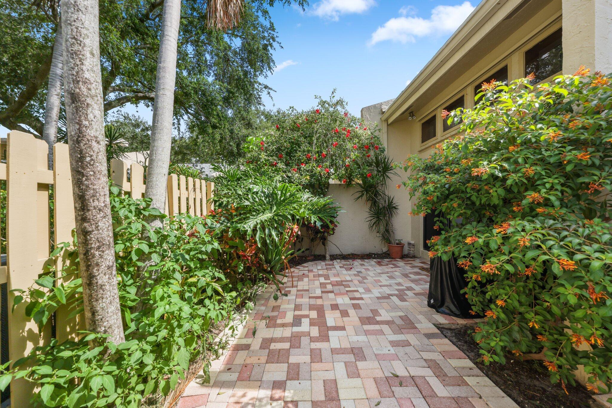 1400 Northwest 9th Avenue, Unit E34 Boca Raton, FL 33486 - Photo 35 of 46 a view of a pathway with plants