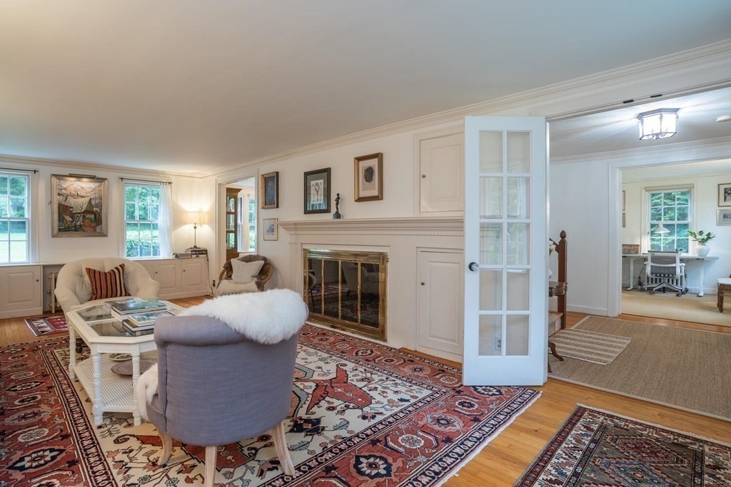 28 Dana Street Amherst, MA 01002 - Photo 8 of 41 a living room with furniture a rug and a fireplace