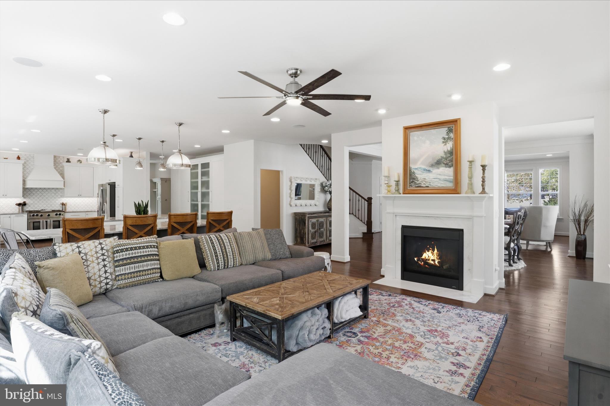 8383 Edward Carr Court Springfield, VA 22153 - Photo 18 of 57 a living room with furniture and a fireplace