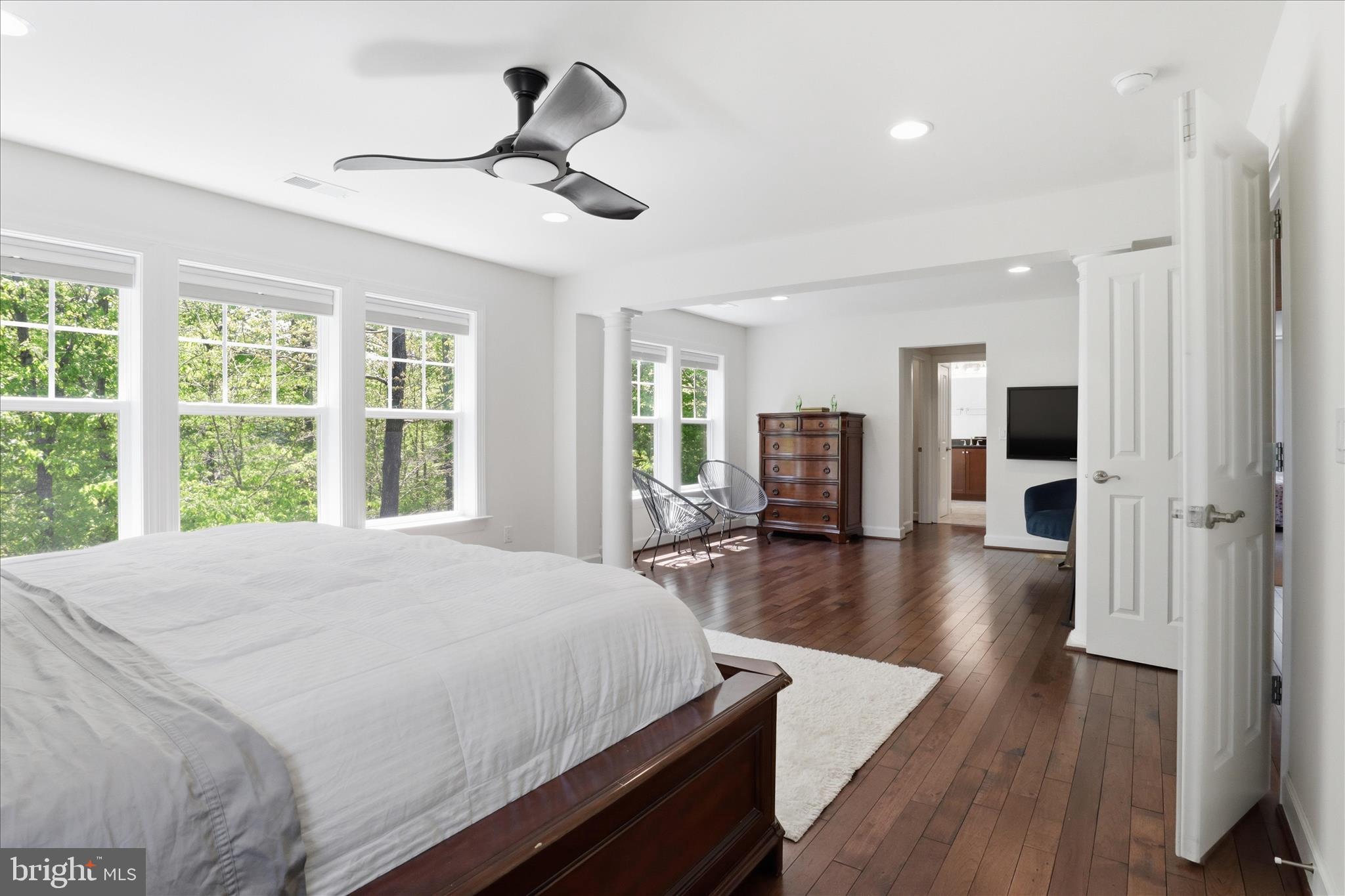 8383 Edward Carr Court Springfield, VA 22153 - Photo 25 of 57 a large bed sitting in a spacious bedroom next to a window