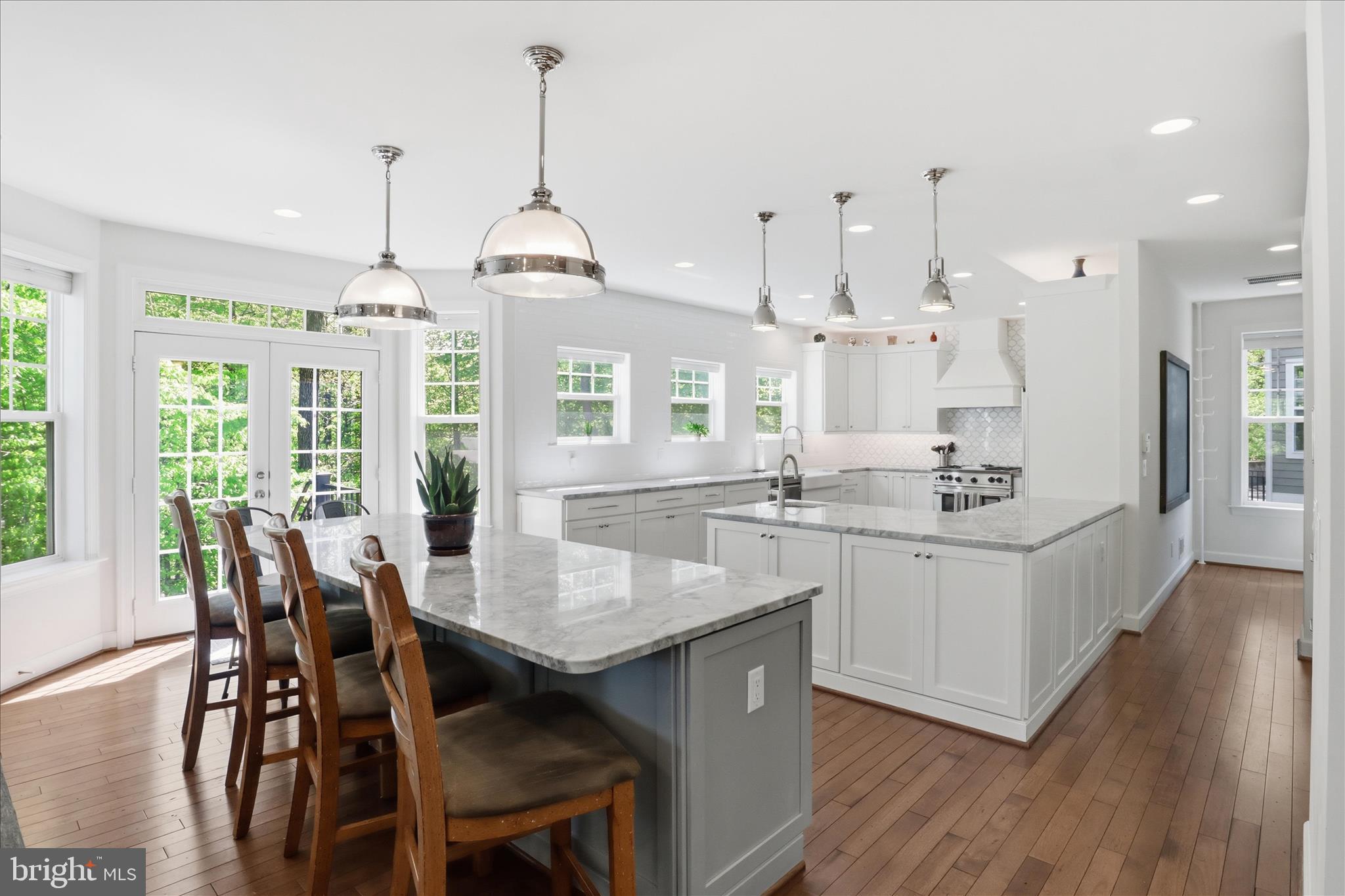8383 Edward Carr Court Springfield, VA 22153 - Photo 9 of 57 a large kitchen with a table and chairs