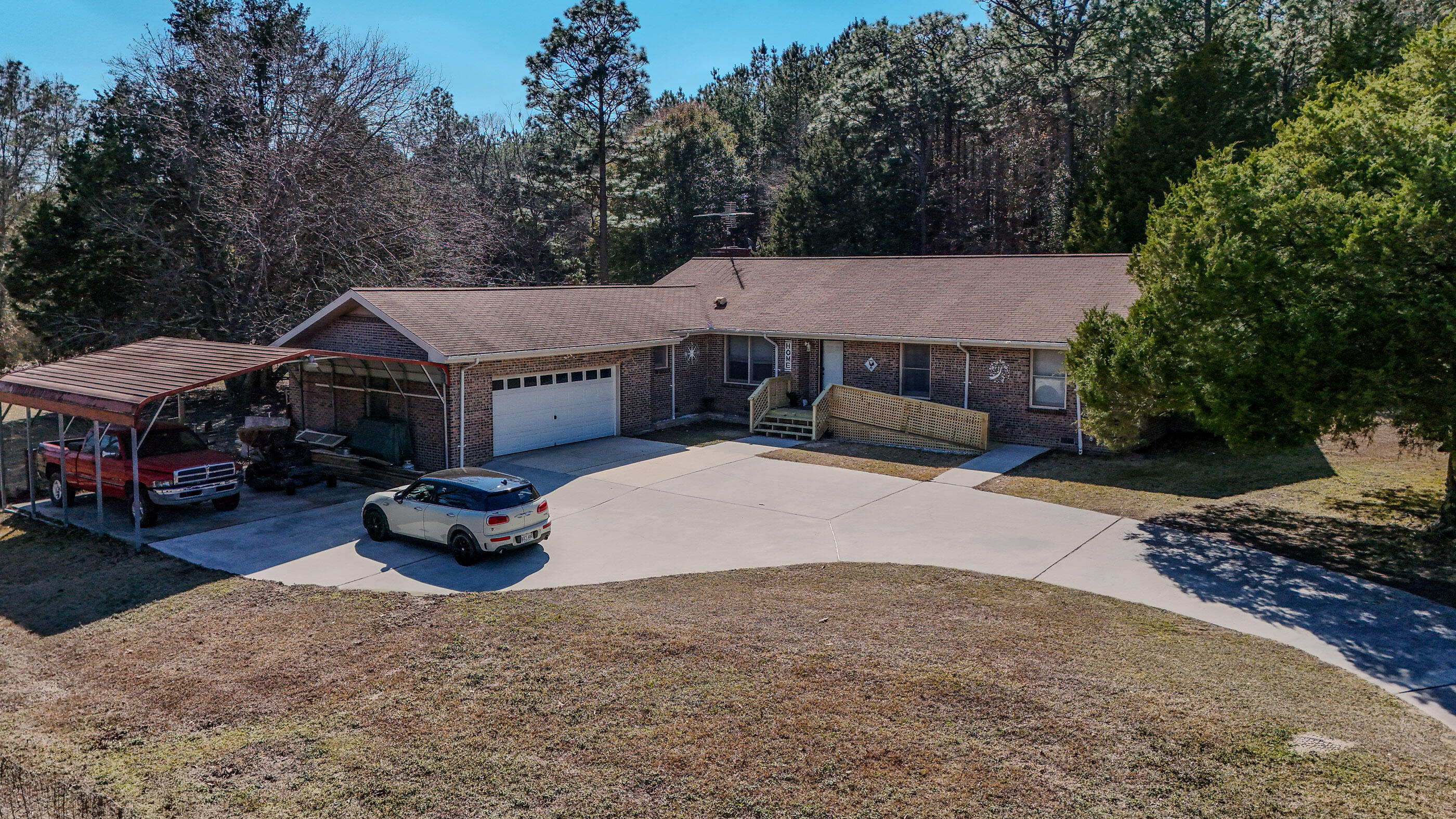 4383 Glen Chambers Road Florala, AL 36442 - Photo 1 of 48 a front view of house with yard and trees in the background