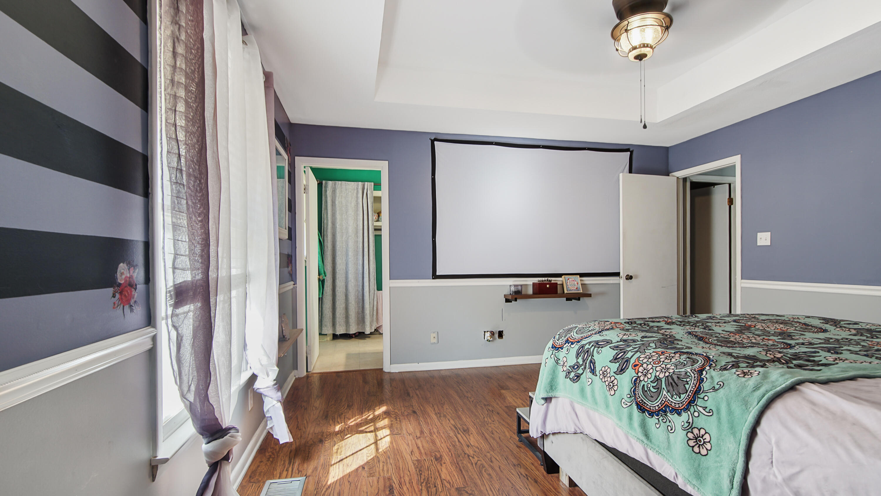 4383 Glen Chambers Road Florala, AL 36442 - Photo 17 of 48 a bedroom with a bed dresser and a flat screen tv