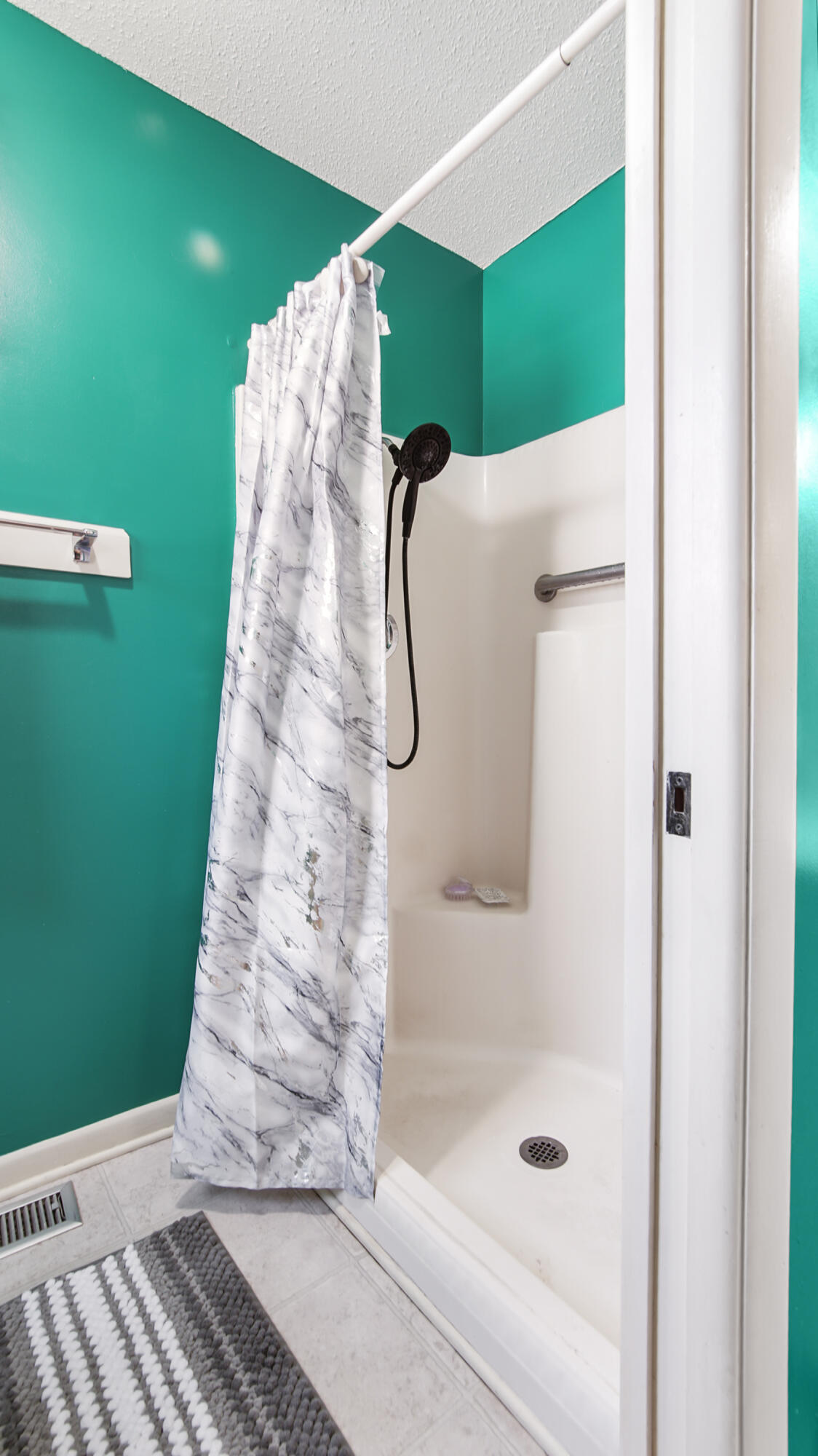 4383 Glen Chambers Road Florala, AL 36442 - Photo 21 of 48 a bathroom with a mirror and a shower