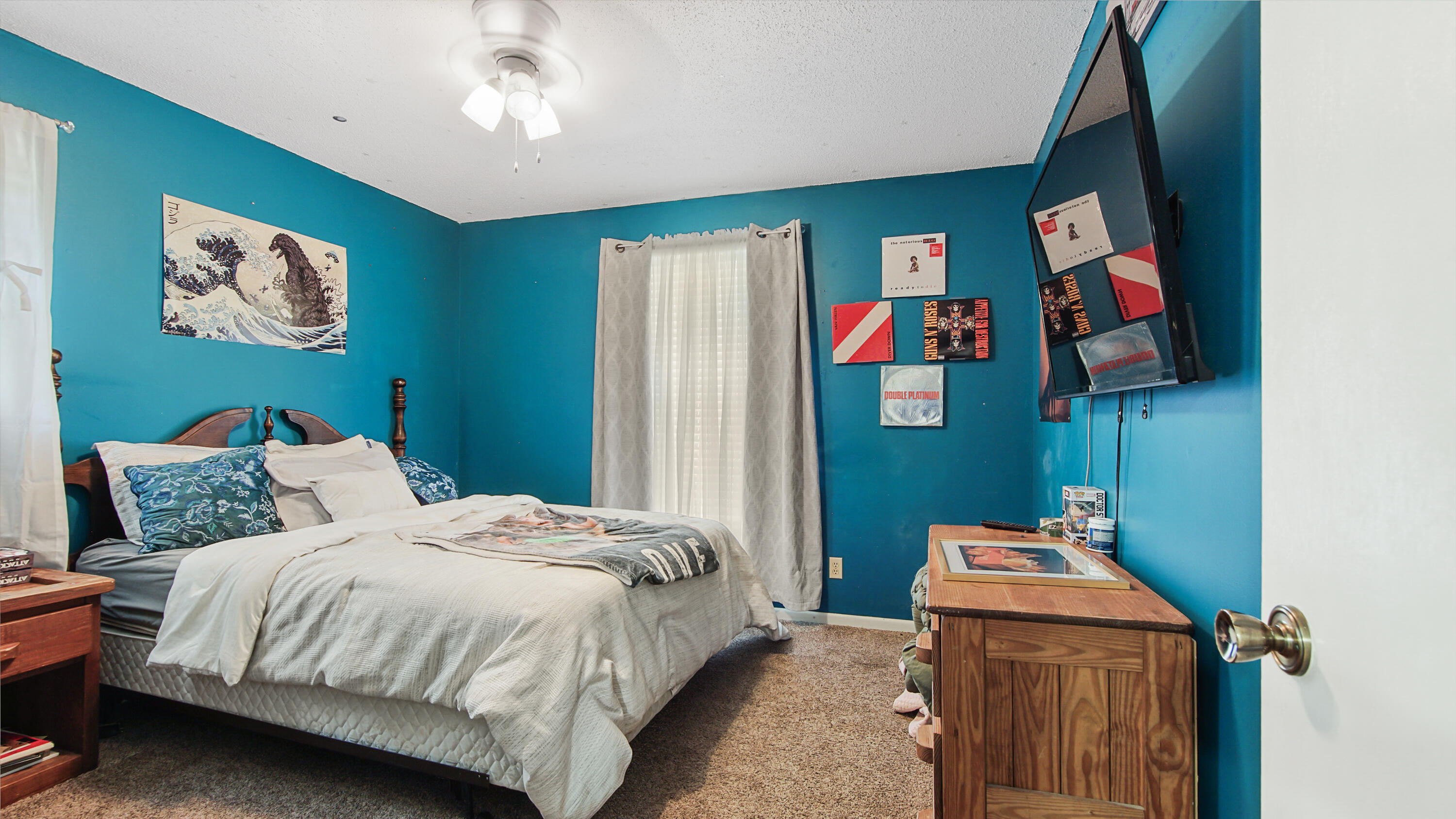4383 Glen Chambers Road Florala, AL 36442 - Photo 28 of 48 a bedroom with a bed and painting on the wall