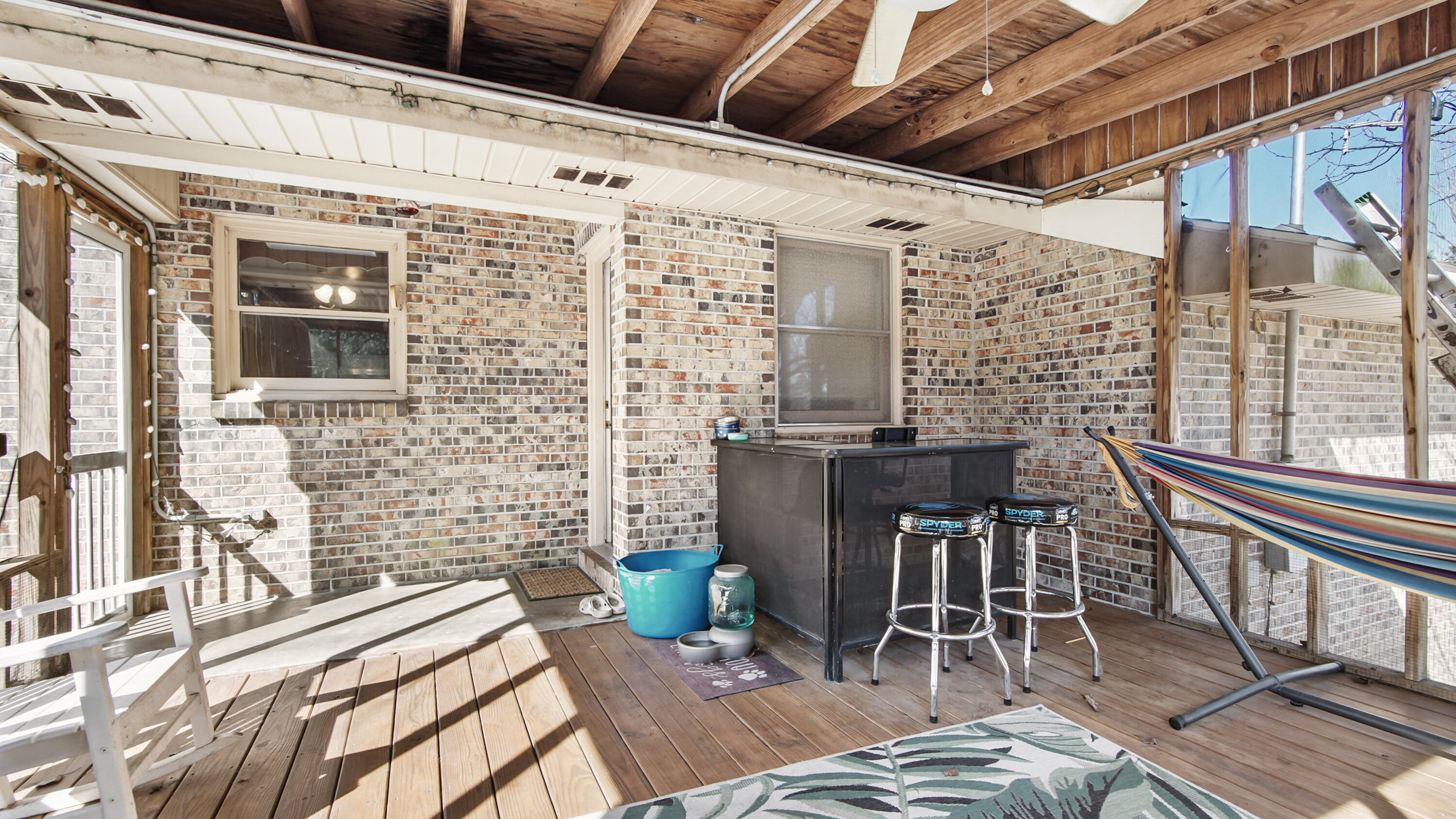 4383 Glen Chambers Road Florala, AL 36442 - Photo 37 of 48 a view of a patio with table and chairs and wooden floor