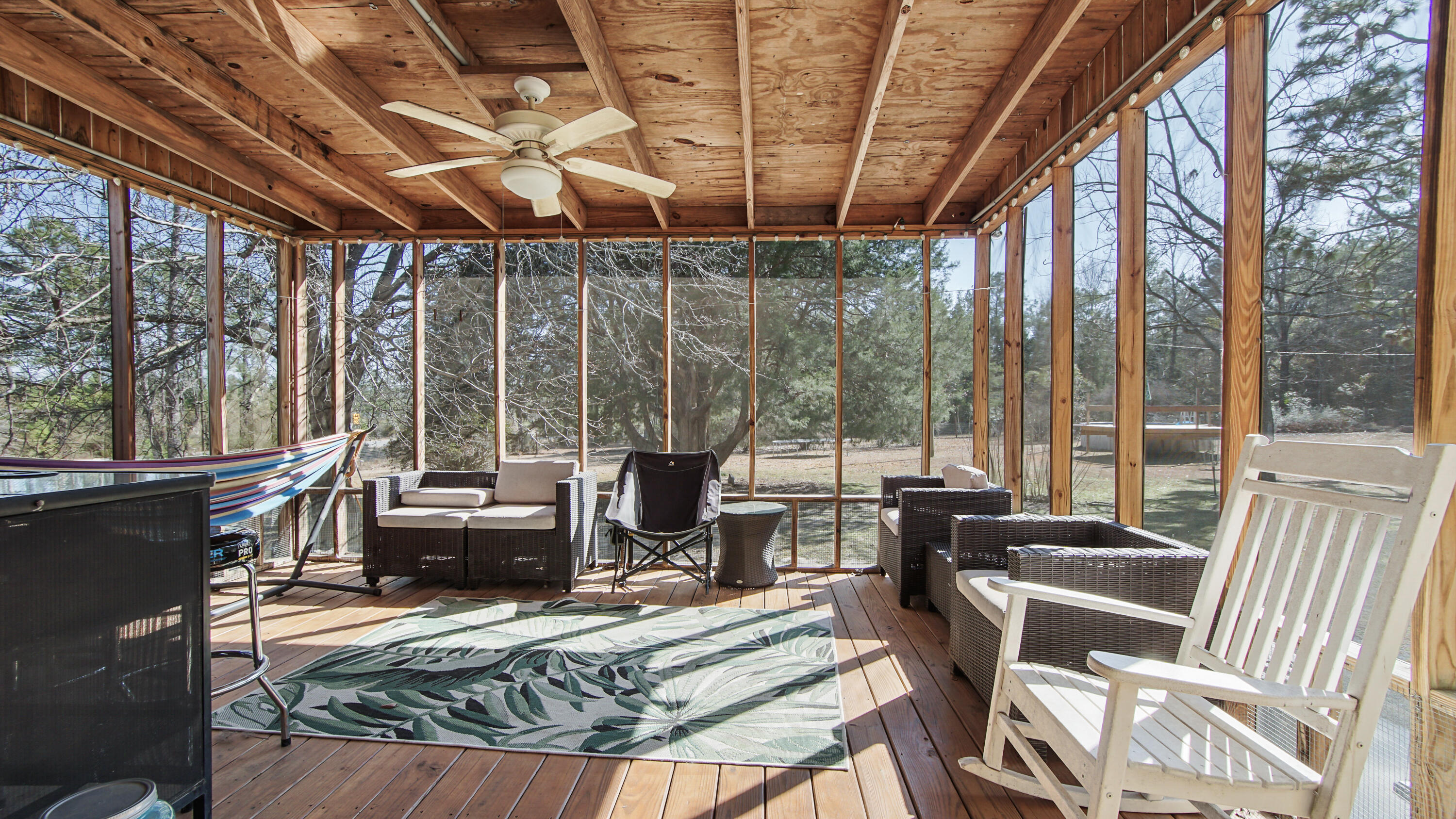 4383 Glen Chambers Road Florala, AL 36442 - Photo 38 of 48 a view of a dining room with furniture large windows and wooden floor
