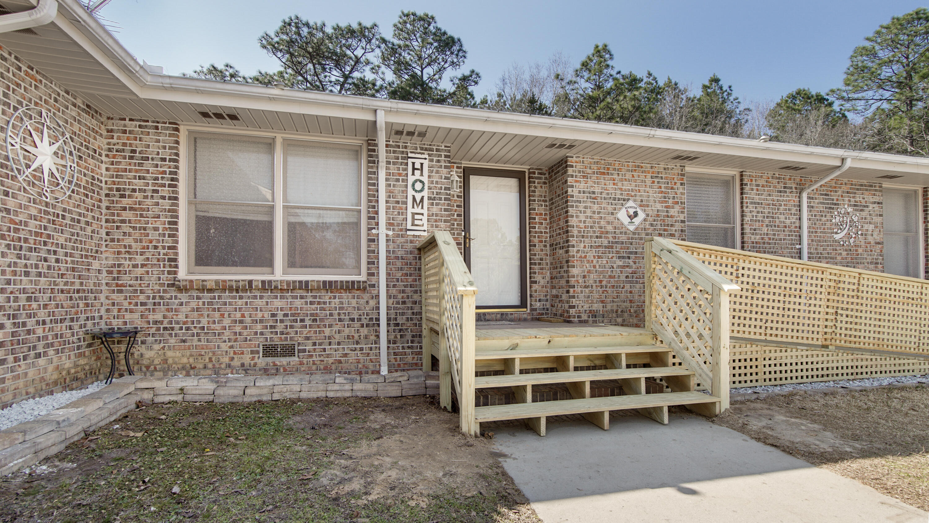 4383 Glen Chambers Road Florala, AL 36442 - Photo 46 of 48 a view of a house with a large window and wooden fence