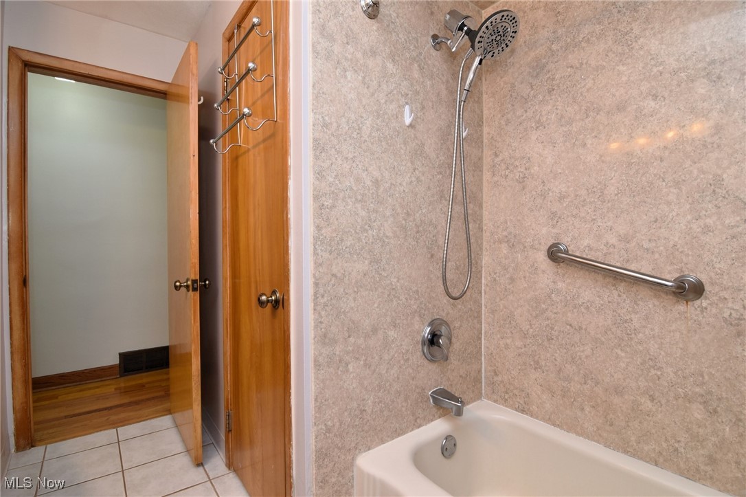 317 Nobottom Road Berea, OH 44017 - Photo 22 of 49 Bathroom with hardwood / wood-style floors and bathtub / shower combination