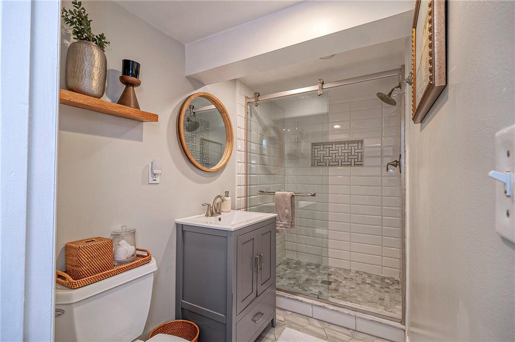 476 Haverhill Road Pittsburgh, PA 15228 - Photo 15 of 36 a bathroom with a toilet a sink and a shower