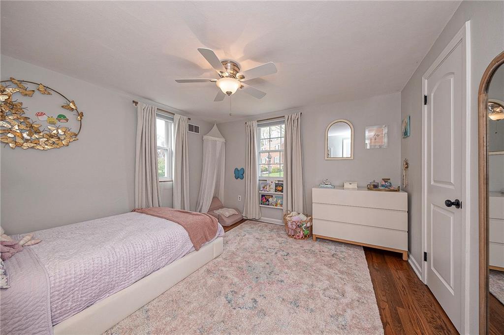 476 Haverhill Road Pittsburgh, PA 15228 - Photo 20 of 36 a spacious bedroom with a bed and a chandelier