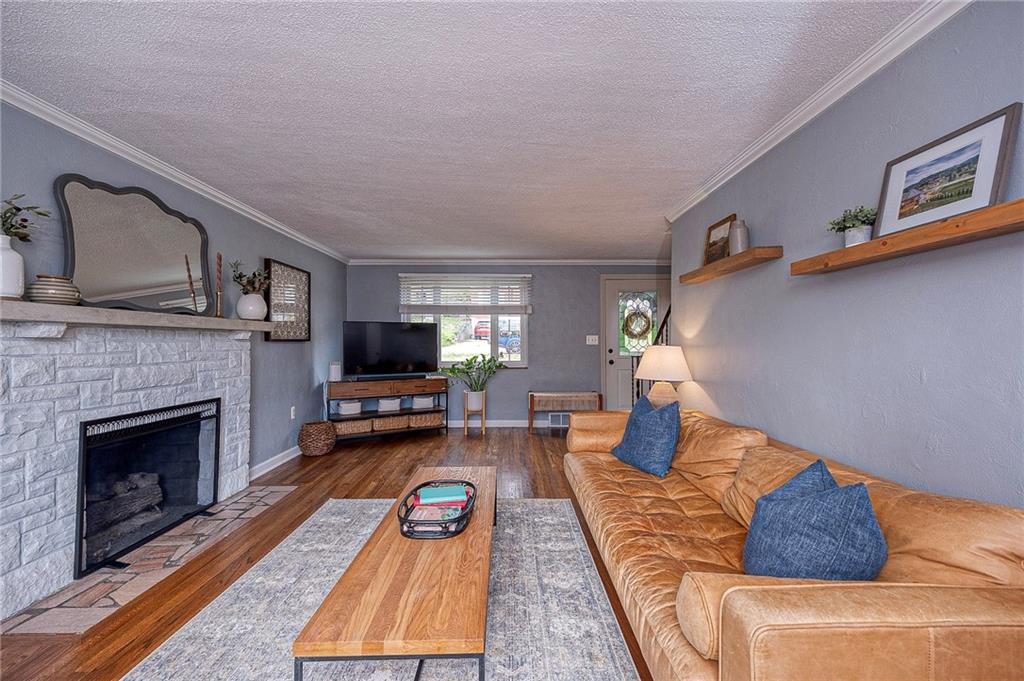 476 Haverhill Road Pittsburgh, PA 15228 - Photo 2 of 36 a living room with furniture and a fireplace