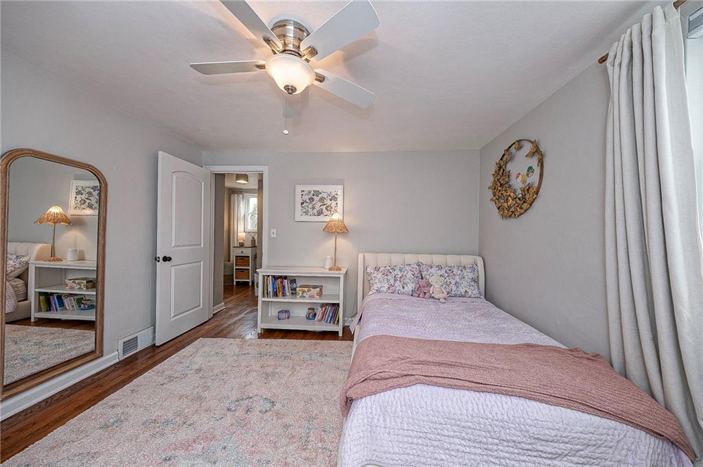 476 Haverhill Road Pittsburgh, PA 15228 - Photo 21 of 36 a bedroom with a bed and a chandelier