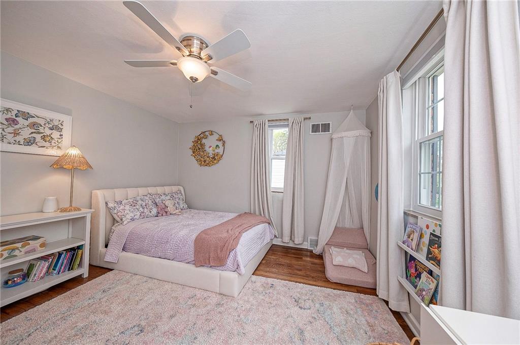476 Haverhill Road Pittsburgh, PA 15228 - Photo 22 of 36 a bedroom with a bed and a chandelier