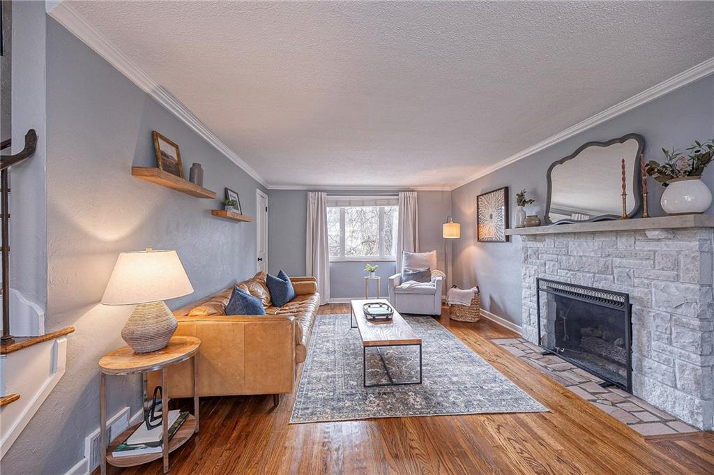 476 Haverhill Road Pittsburgh, PA 15228 - Photo 3 of 36 a living room with furniture and a fireplace