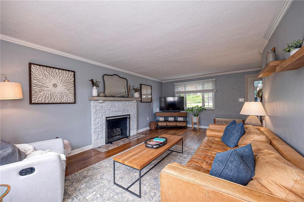 476 Haverhill Road Pittsburgh, PA 15228 - Photo 6 of 36 a living room with furniture and a fireplace