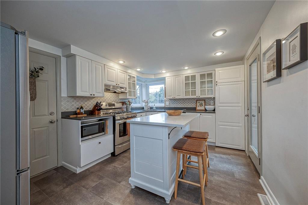 476 Haverhill Road Pittsburgh, PA 15228 - Photo 10 of 36 a kitchen with a refrigerator and a stove top oven