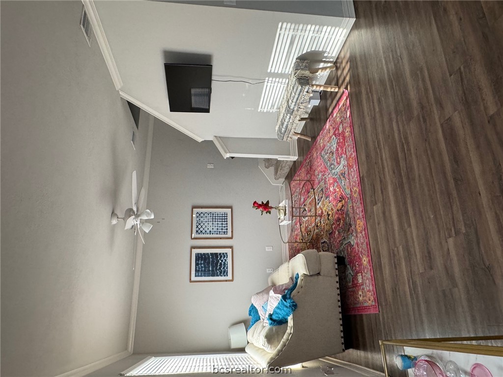 6991 Halter Loop College Station, TX 77845 - Photo 2 of 10 a bedroom with furniture and a wooden floor