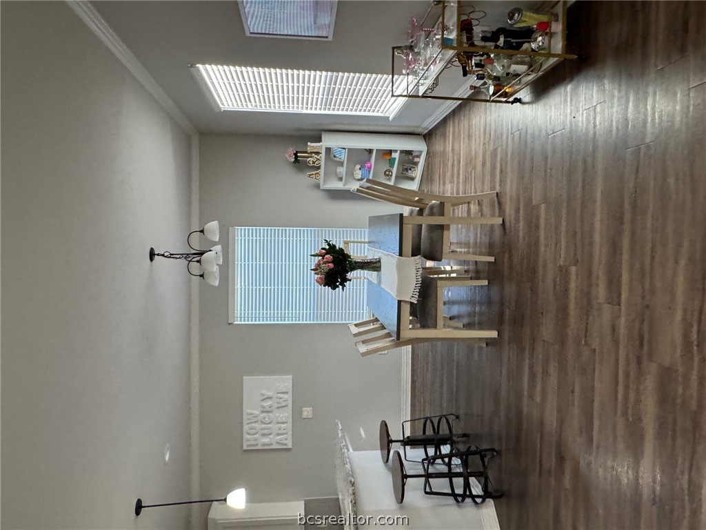 6991 Halter Loop College Station, TX 77845 - Photo 3 of 10 a dining room with furniture and wooden floor