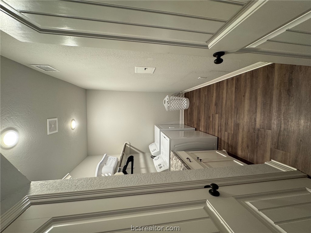 6991 Halter Loop College Station, TX 77845 - Photo 5 of 10 a bathroom with sink a toilet and a mirror