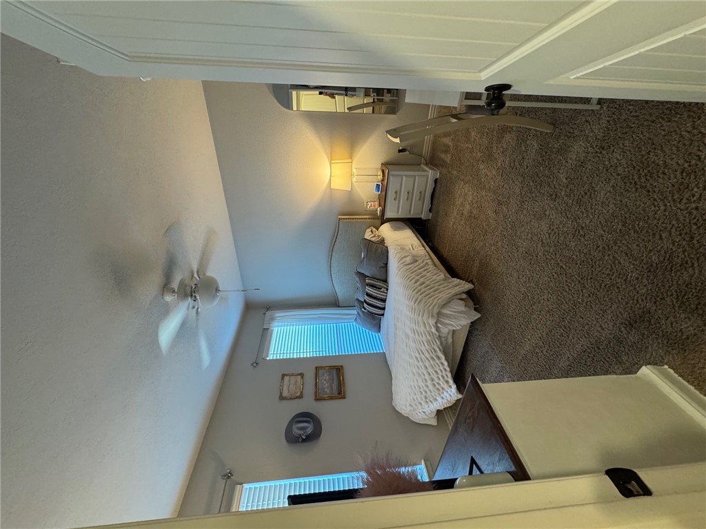 6991 Halter Loop College Station, TX 77845 - Photo 7 of 10 a bedroom with a bed and a mirror