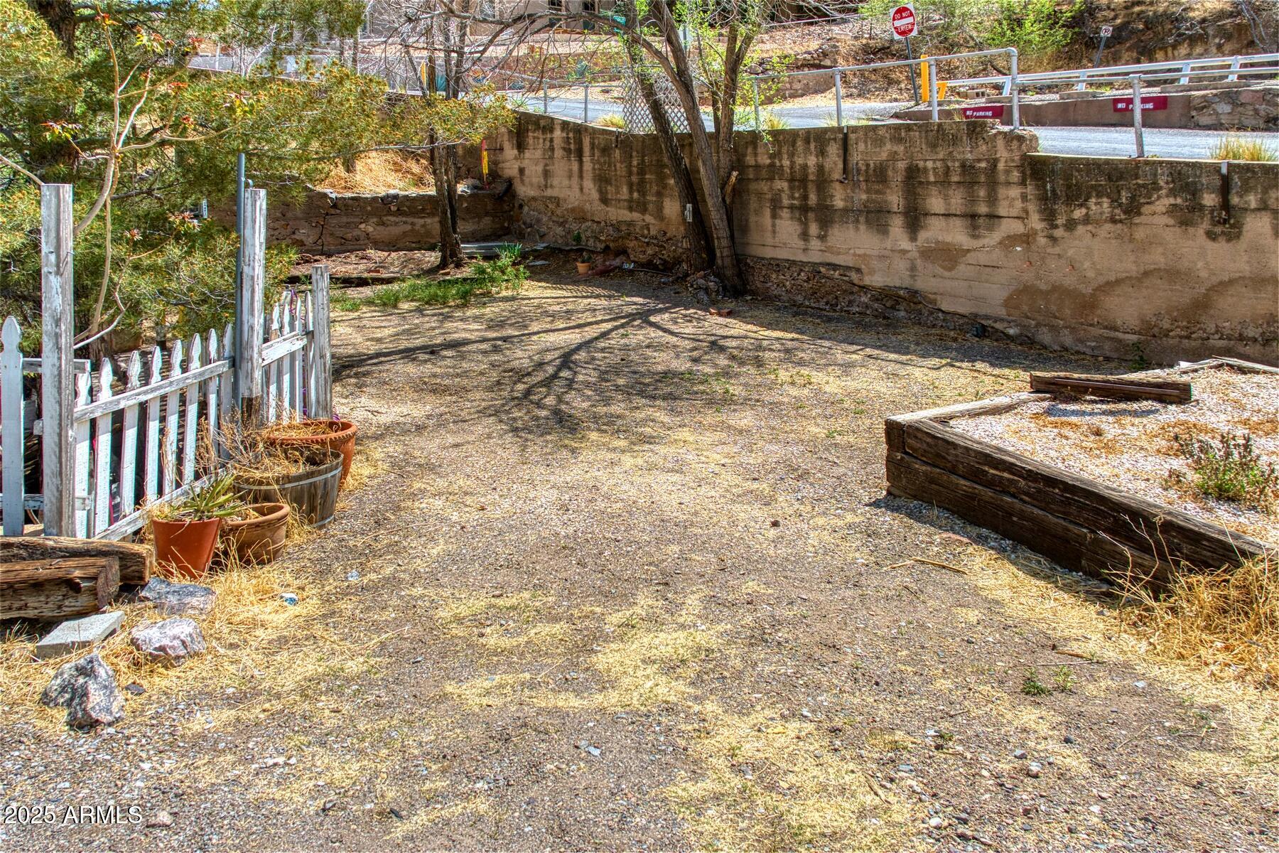 10 Quality Hill Road, Unit 5 Bisbee, AZ 85603 - Photo 4 of 13 a view of a yard with wooden fence