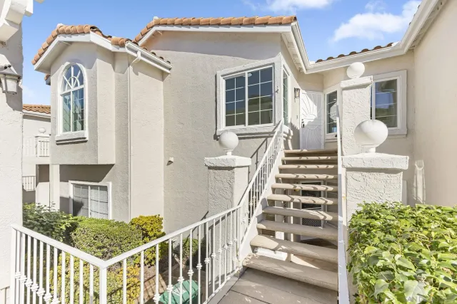 a view of a house with wooden floor and windows