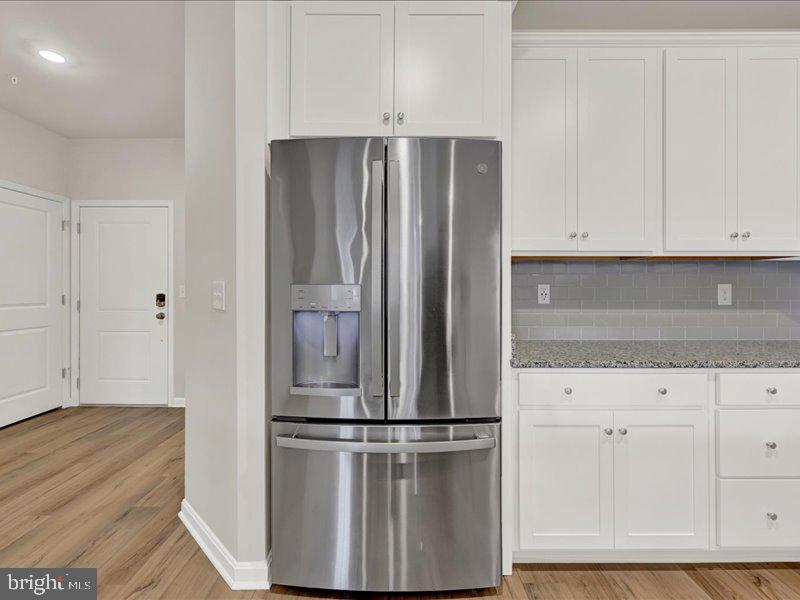 4005 Seaside Alder Road, Unit D Bowie, MD 20720 - Photo 13 of 41 a view of kitchen with refrigerator and cabinet