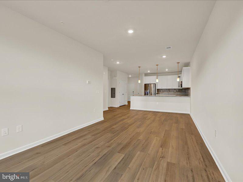 4005 Seaside Alder Road, Unit D Bowie, MD 20720 - Photo 20 of 41 a view of a kitchen with wooden floor and kitchen