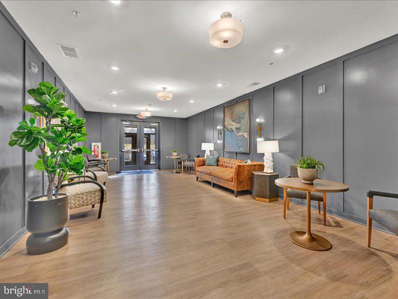 4005 Seaside Alder Road, Unit D Bowie, MD 20720 - Photo 2 of 41 a living room with furniture and a potted plant