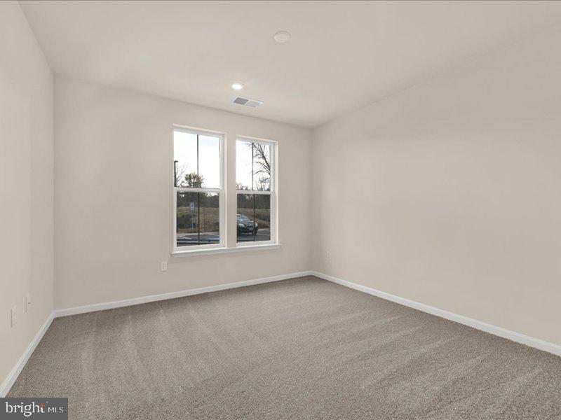 4005 Seaside Alder Road, Unit D Bowie, MD 20720 - Photo 22 of 41 a view of an empty room with a window