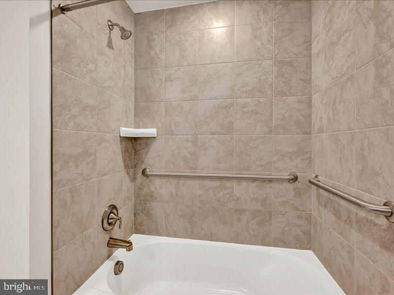 4005 Seaside Alder Road, Unit D Bowie, MD 20720 - Photo 25 of 41 a bathroom with a shower and a bathtub