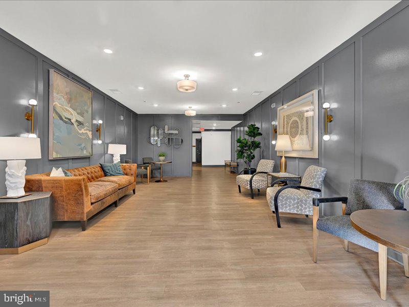4005 Seaside Alder Road, Unit D Bowie, MD 20720 - Photo 3 of 41 a living room with furniture and a large mirror with wooden floor