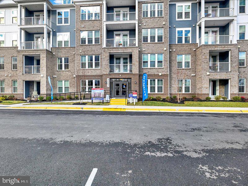 4005 Seaside Alder Road, Unit D Bowie, MD 20720 - Photo 31 of 41 a view of building with a swimming pool