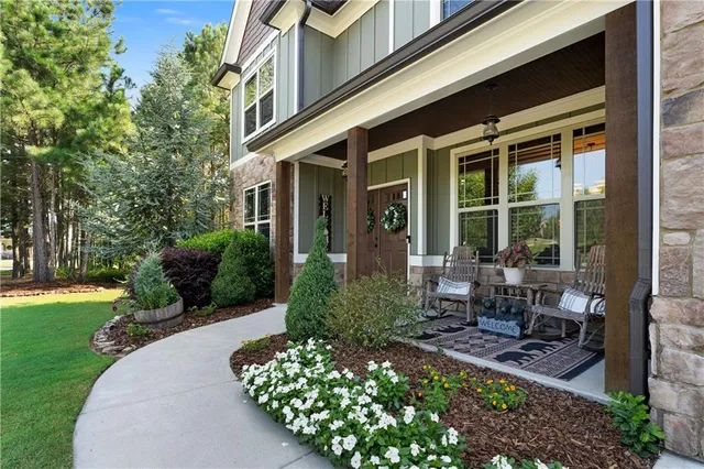 a front view of a house with garden