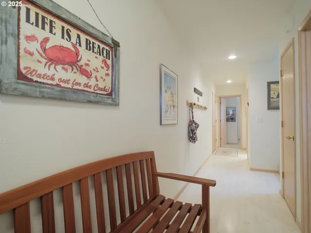 a view of a hallway with paintings on the wall
