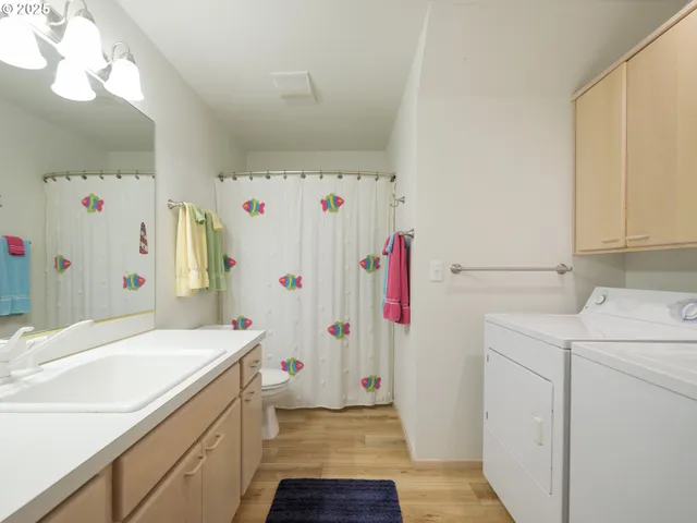 a utility room with dryer and washer